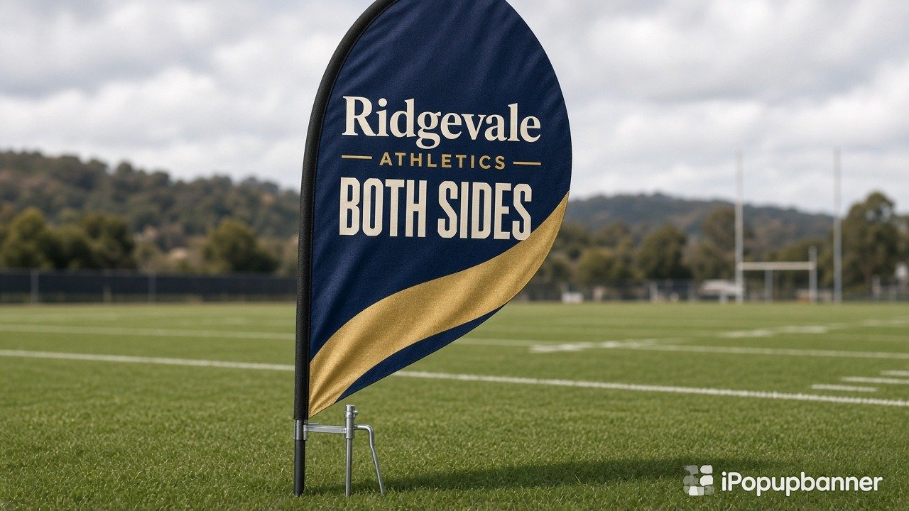 Teardrop flag Double Sided on grass with inground spike, Ridgevale Athletics BOTH SIDES print on closed-loop face, iPopupbanner watermark