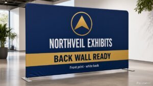 Straight tension fabric display pillowcase booth wall with Northveil Exhibits BACK WALL READY print fused on drum-taut face, silver T-feet, front print white back, iPopupbanner watermark